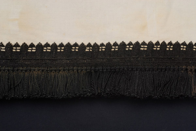 Border, detail of the severe decoration with koukoulia gazisia, stromena with stavrovoulia and full of vertical stitches 