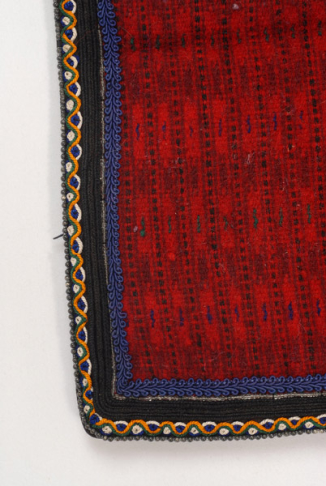 Edges of the apron, detail of the applique decoration with braids, cordons, beads and felt bands with stylized decoration