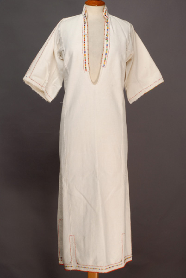 White cotton woven chemise, ornamented with mat and glistening beads and spangles 