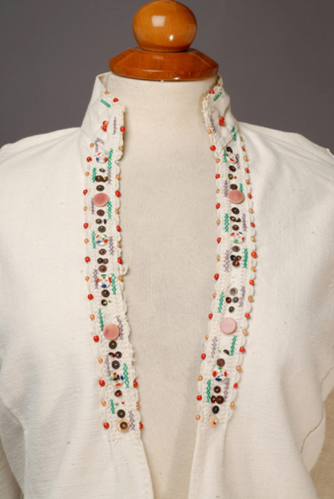 Plastron, detail of the applique decoration