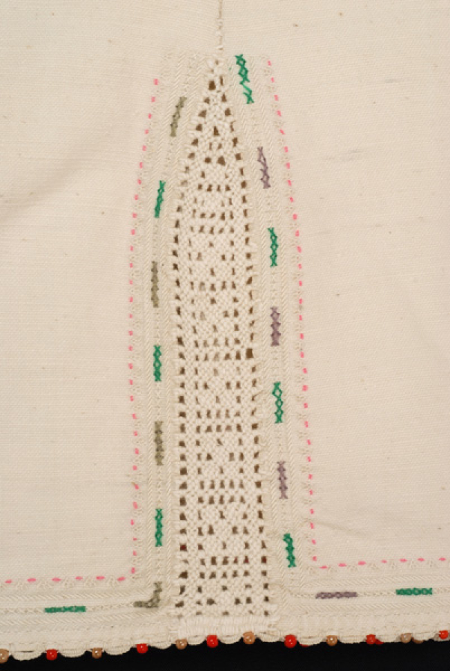 Border, detail of the lacy band of the seam, the embroidered and the applique decoration