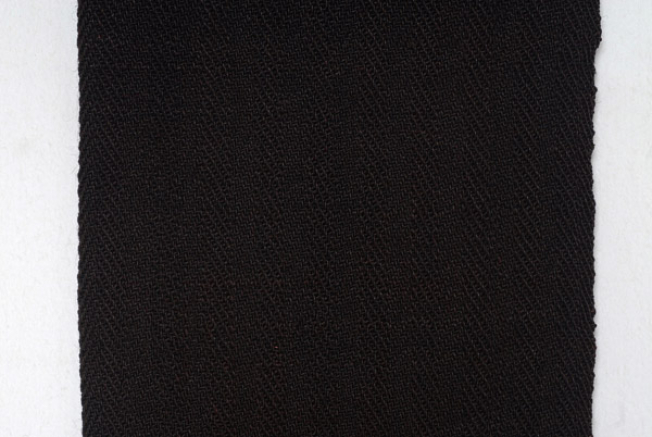 Detail of the embellished decoration in herring-bone stitch technique 