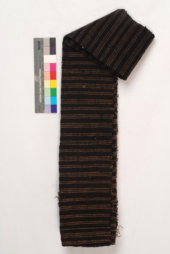 Very long, handwoven dark brown woollen sash with embellished horizontal narrow stripes, folded lengthwise