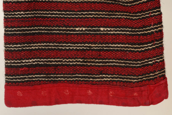 Detail of the applique decoration at the hem of the sleeve