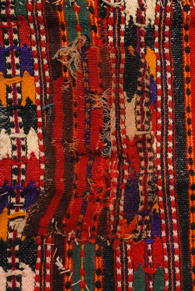 Apron from Episkopi, part of the back view and a patch