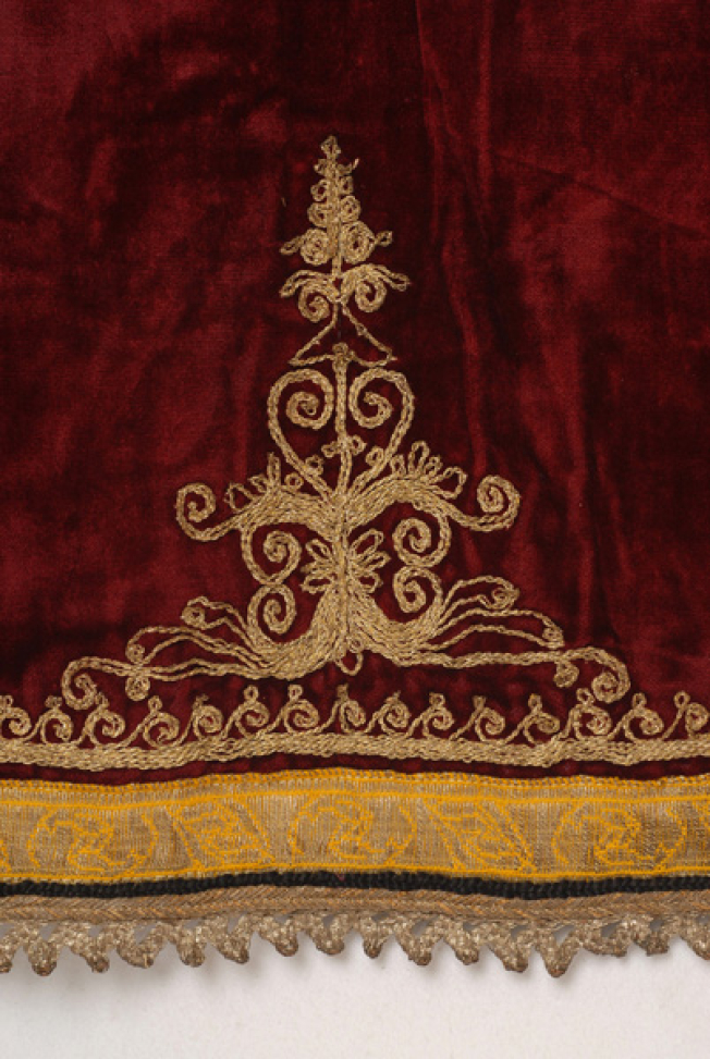 Detail of the decoration at the back bottom of the katifes: embroidered stylized motif and spiral meander, applique gold fillet and lace made of silver thread