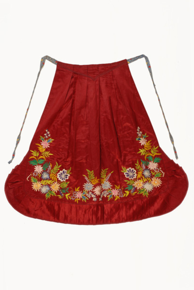 Festive apron made of red satin fabric with multicoloured silk decoration