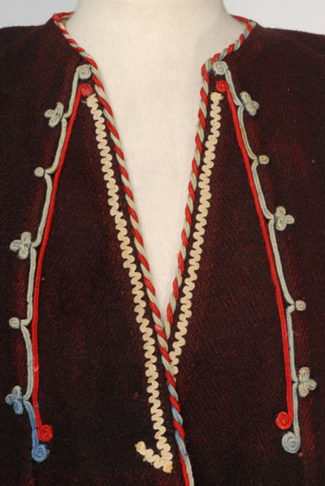 Detail of the applique decoration at the chest