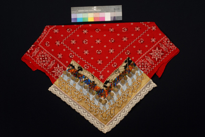 Additional plastron made of red cotton printed fabric with applique decoration