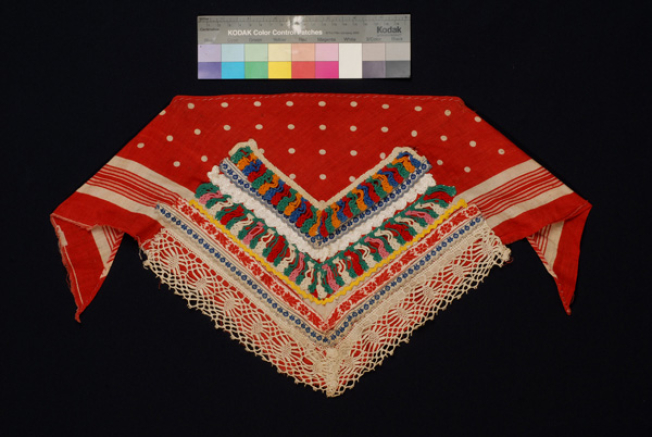 Triangle additional plastron made of red cotton printed fabric with applique decoration