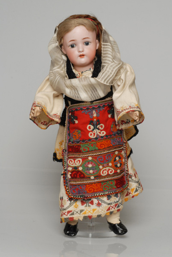 Porcelain doll, in the girl's costume of Aedipsos, from the doll's collection of Queen Olga 