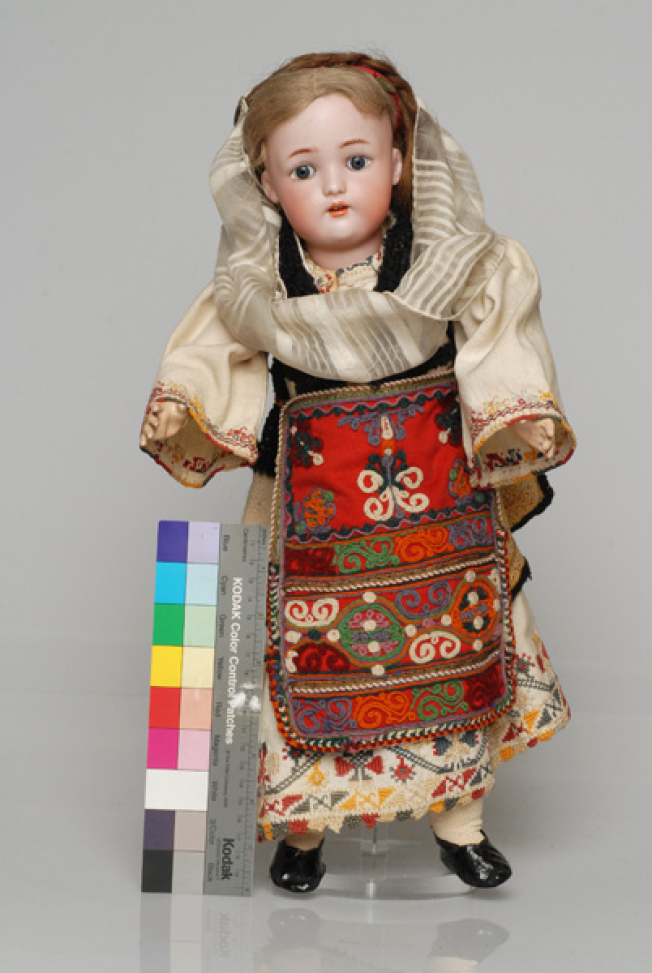 Porcelain doll, in the girl's costume of Aedipsos, from the doll's collection of Queen Olga 
