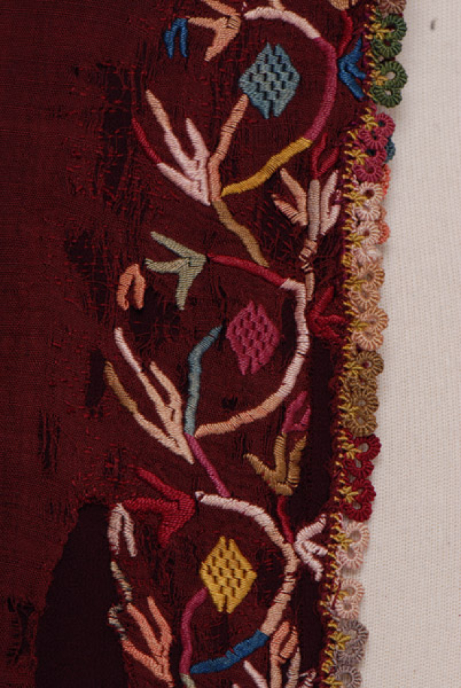 Sleeve, detail of the decorative motif and the lace