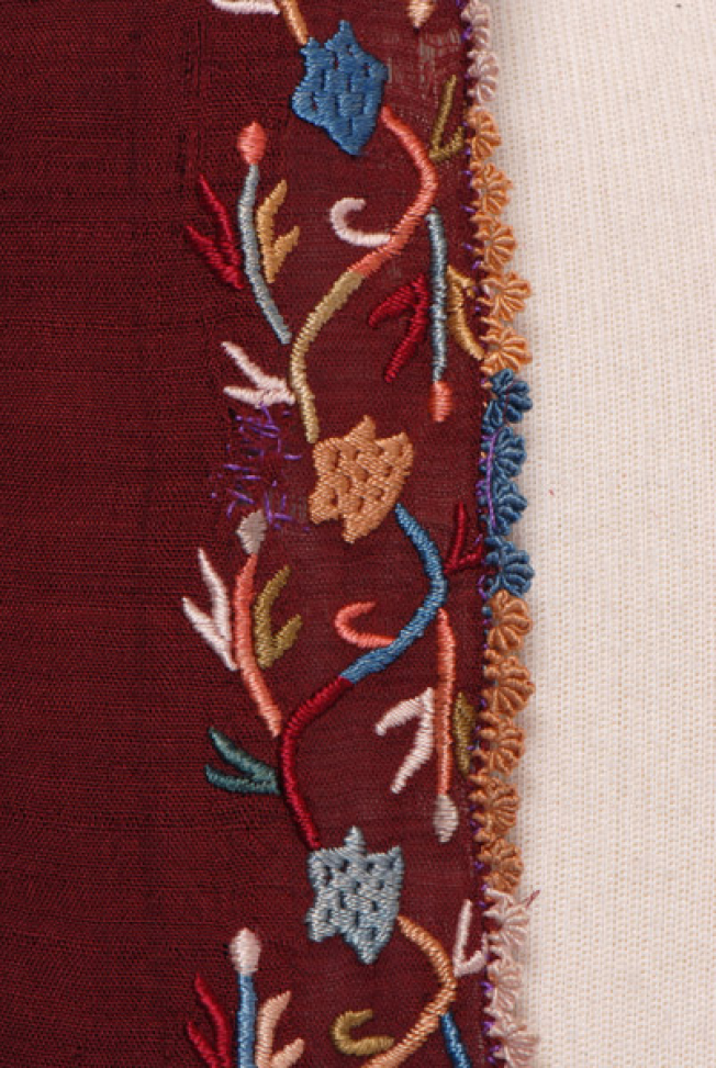 Sleeve, detail of the decorative motif and the lace