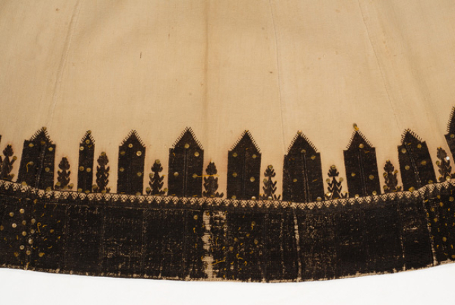 Embroidery at the slant lengths of fabric on the right