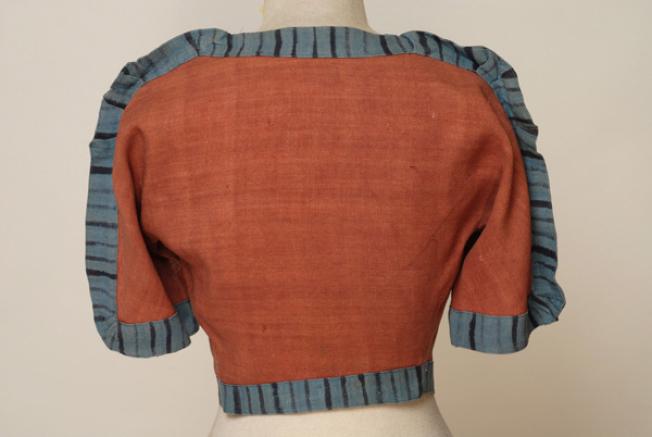 Short sleeved jacket from the costume of a Priestess, back
