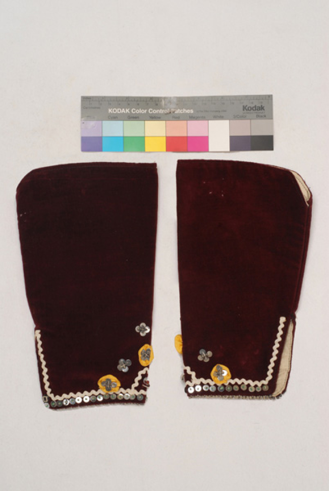 Pair of sleeves made of red velvet, ornamented at the hem with rosettes, spangles, beads and zig-zag off-white braid