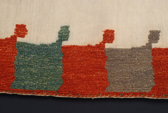 Detail of the decoration, border: square motifs forming a corner