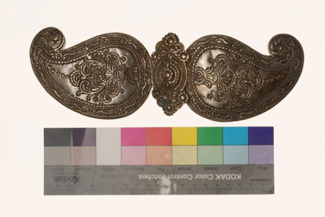 Hammered silver buckle with embossed decoration