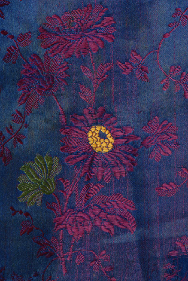 Detail of the decorative motif of the rich brocaded fabric