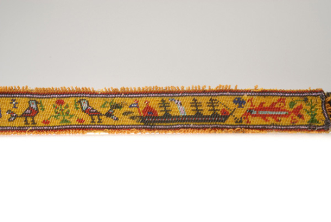 Detail of the decoration with multicoloured beaded zoomorphic and stylized decoration