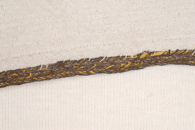 Detail of the decoration with gold thread
