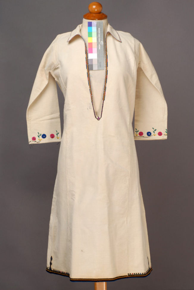White cotton woven chemise, embroidered with woollen and silk coloured threads