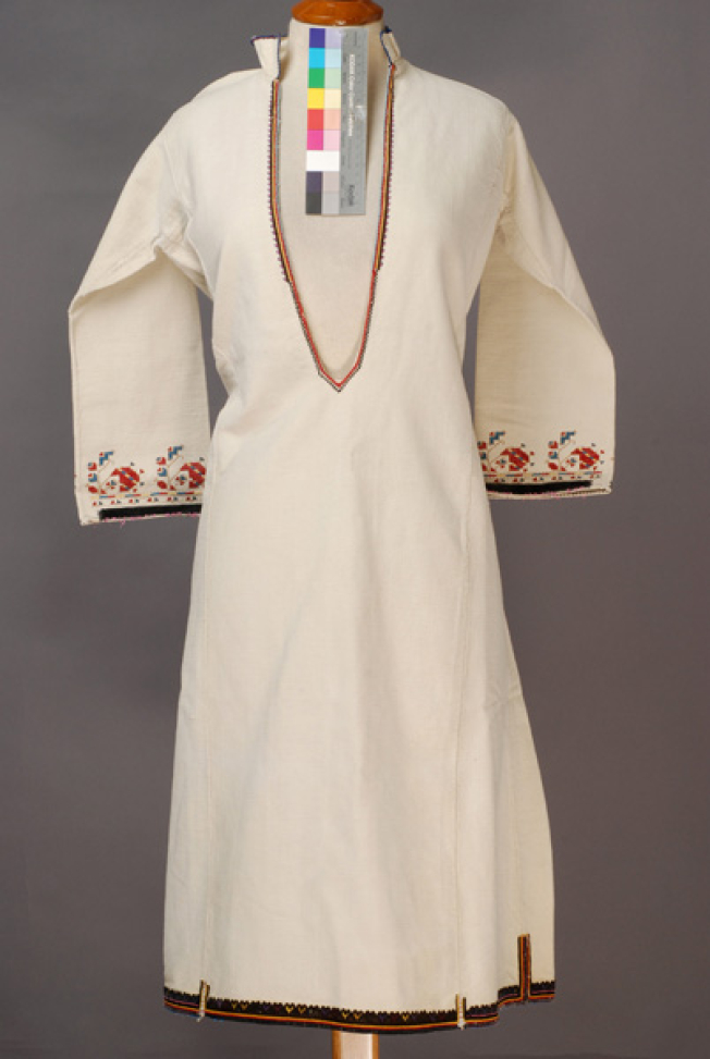 White cotton woven chemise, embroidered with woollen coloured threads