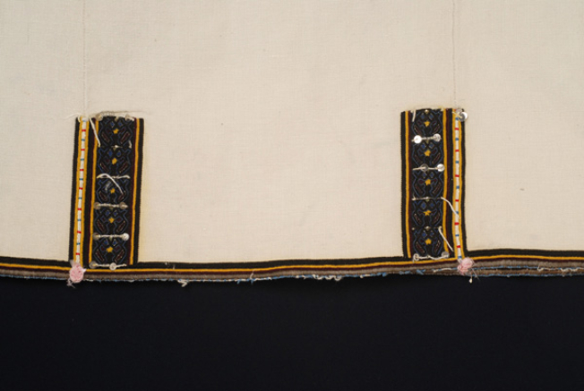 Border (panel of the back), detail of the decoration of the seams with two columnes with stylized motifs