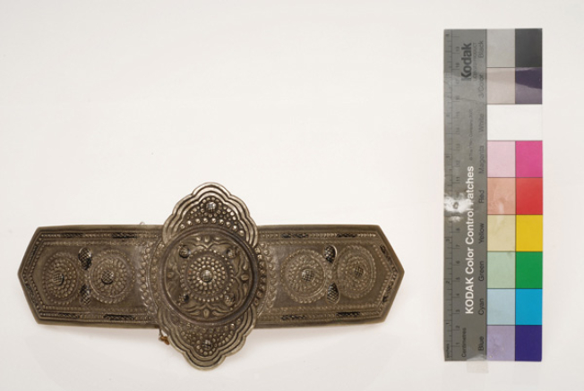 Asimozounaro, silver forged buckle with an embossed decoration. It is also engraved and filled with black savati (enamel)