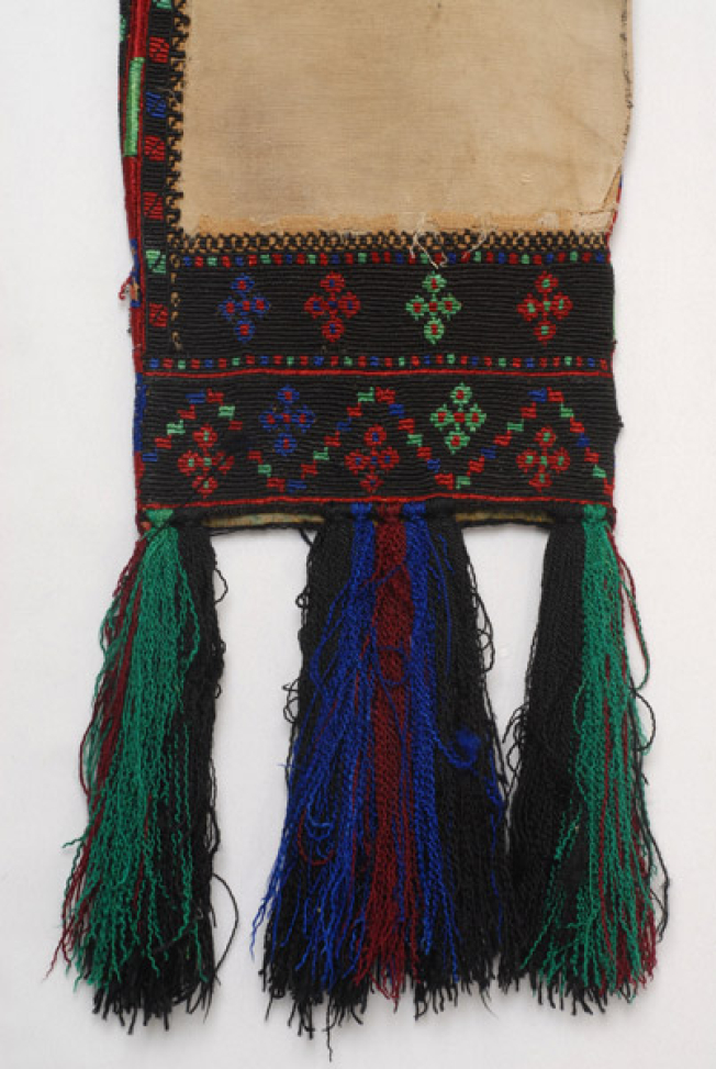 Sleeve, detail of the decoration with logadero embroidery made from an old linen sleeve, applique to a cotton fabric. Coloured over tassels made of sild outradhes