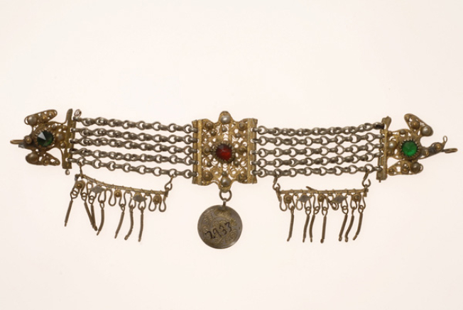 Vastaki, gold plated wiry torso ornament, decorated with coloured glass beads