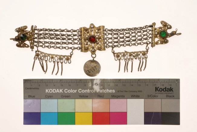 Vastaki, gold plated wiry torso ornament, decorated with coloured glass beads