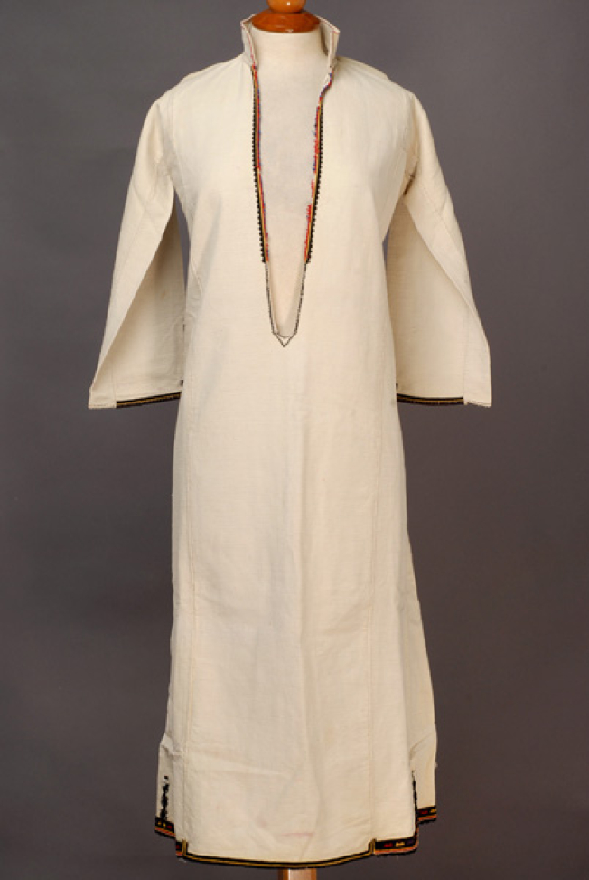 White cotton woven chemise, embroidered with coloured woollen threads