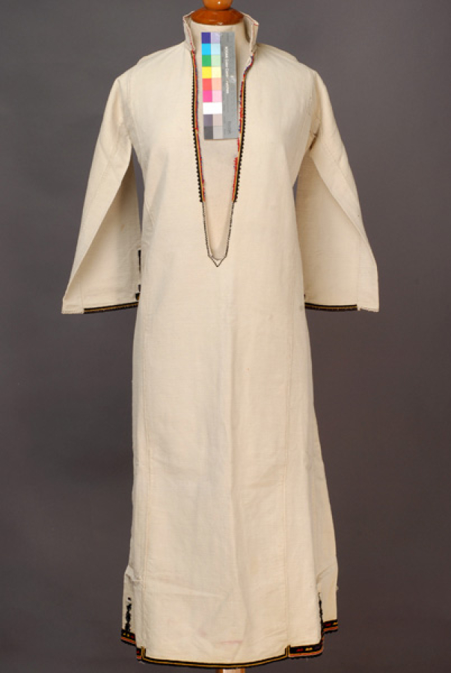 White cotton woven chemise, embroidered with coloured woollen threads