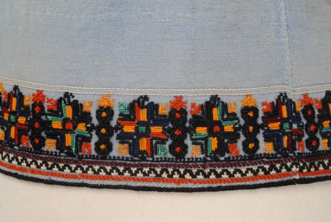 Detail of the embroidered decoration at the indigo dyed podia, border: cordon, horizontal rows and a band with crosses and blossoms