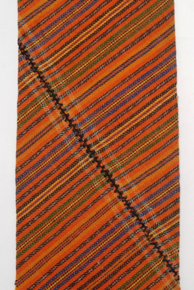 Detail of the decoration, embellished stripes and mertza (embroidered joint)