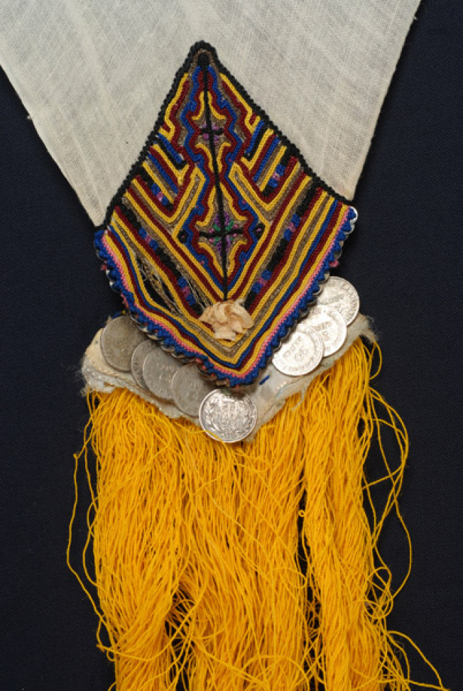 Detail of the decoration, embroidery and applique elements at one of the corners of the kerchief