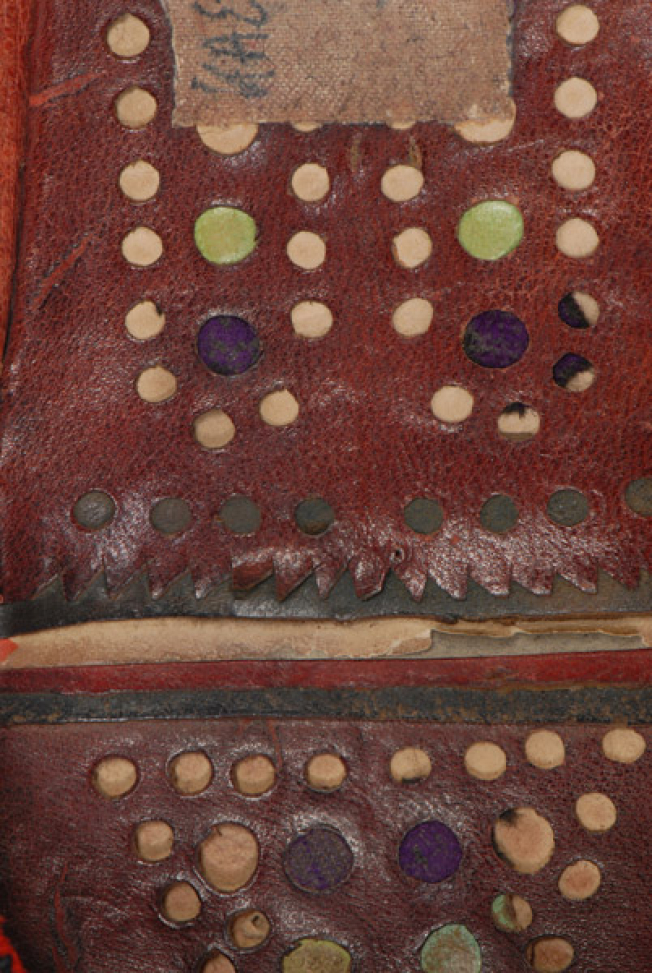 Patouli, coloured holes on leather for the decoration