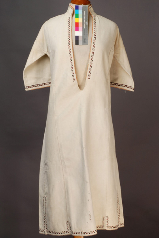 White cotton woven chemise, ornamented with crimson and black embroideries