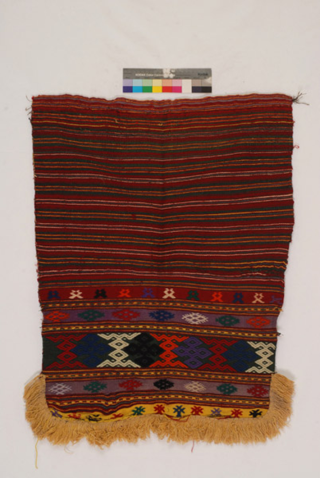 Wool tagarissia apron with loom embroidery