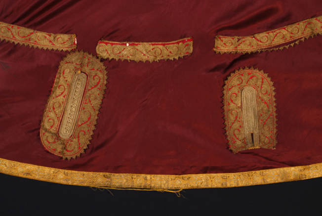 Two gold embroidered motifs at the back