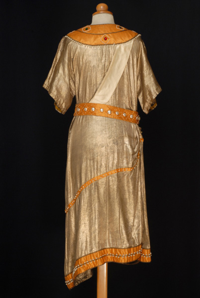 Gold revetted garment, back