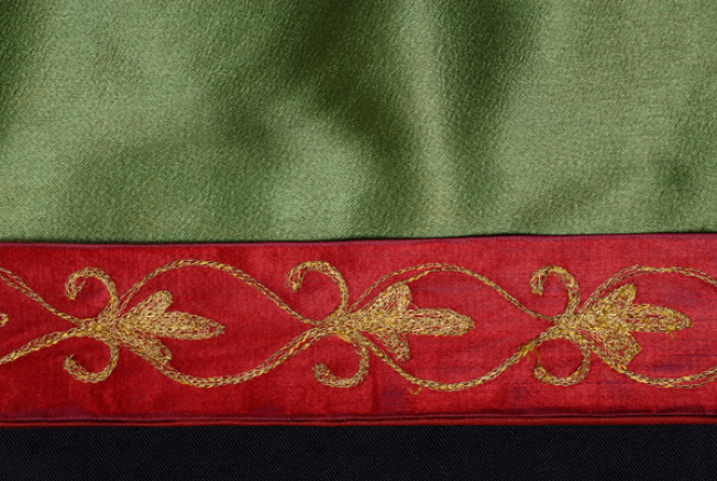 Part of the gold embroidered band