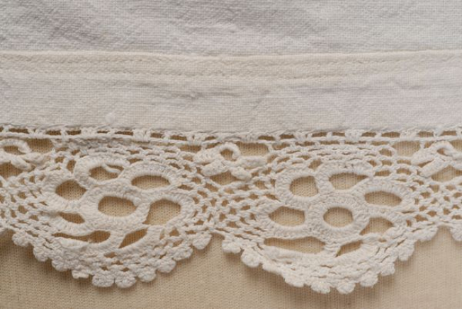 Border, detail of the decoration with cotton lace