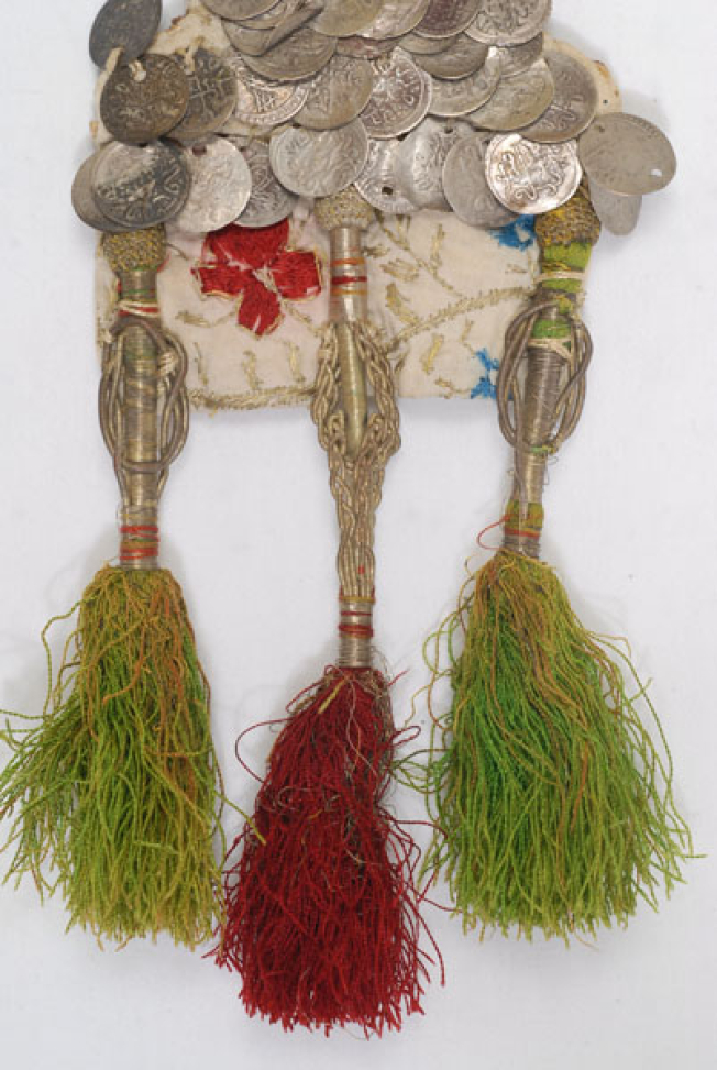 Lower part, detail of the embroidered decoration