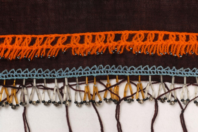 Detail of the applique decoration with bought tanteles (laces)