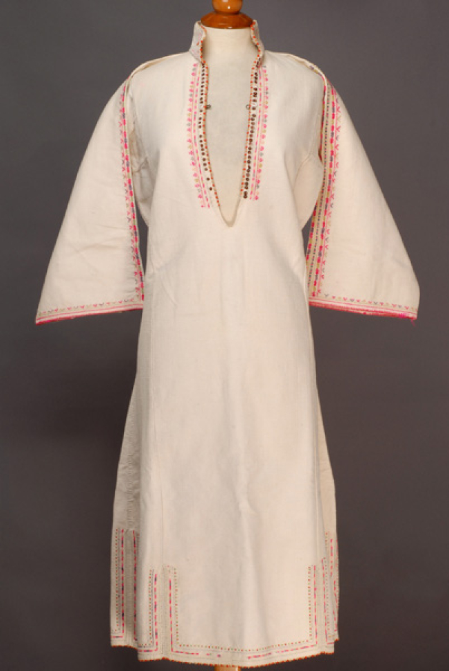 White cotton woven chemise with upright small collar, ornamented with spangles, coloured beads and multicoloured embroideries