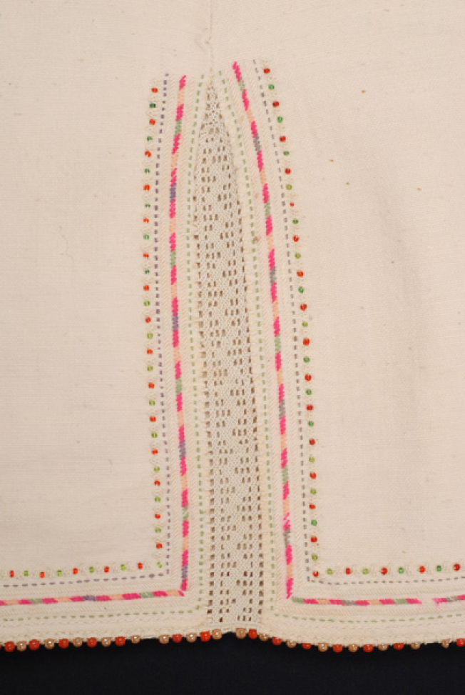 Border, detail of the lacy band of the seam and applique decoration 