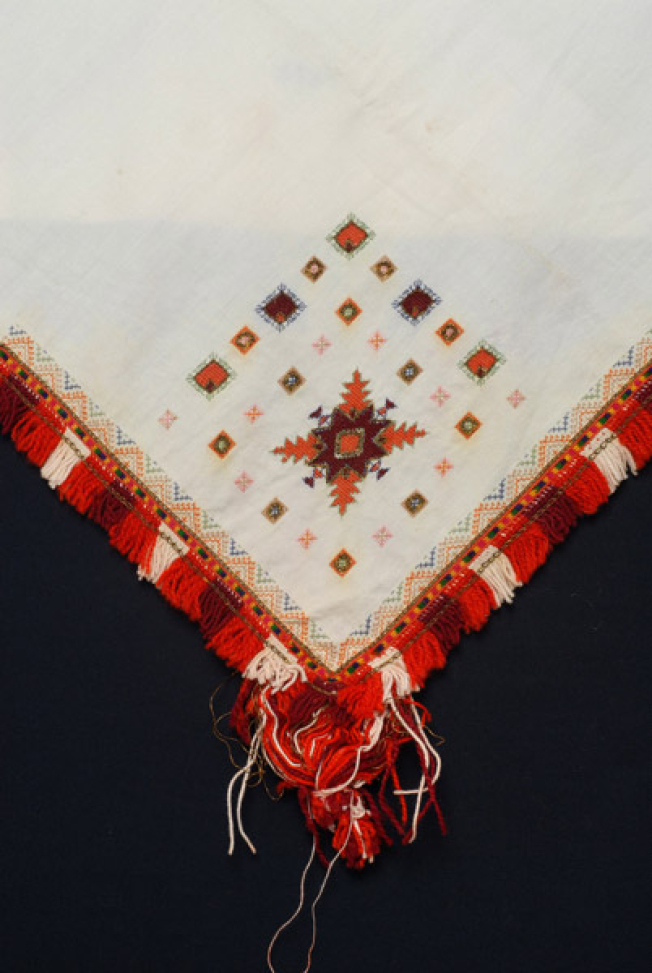 Detail of the decoration, embroidery at one of the corners of the kerchief